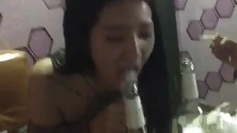 Chinese girl is practicing a blowjob