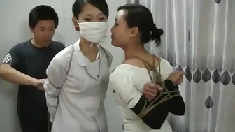 Two Chinese Girls Tied, One Wearing Cloth Mask